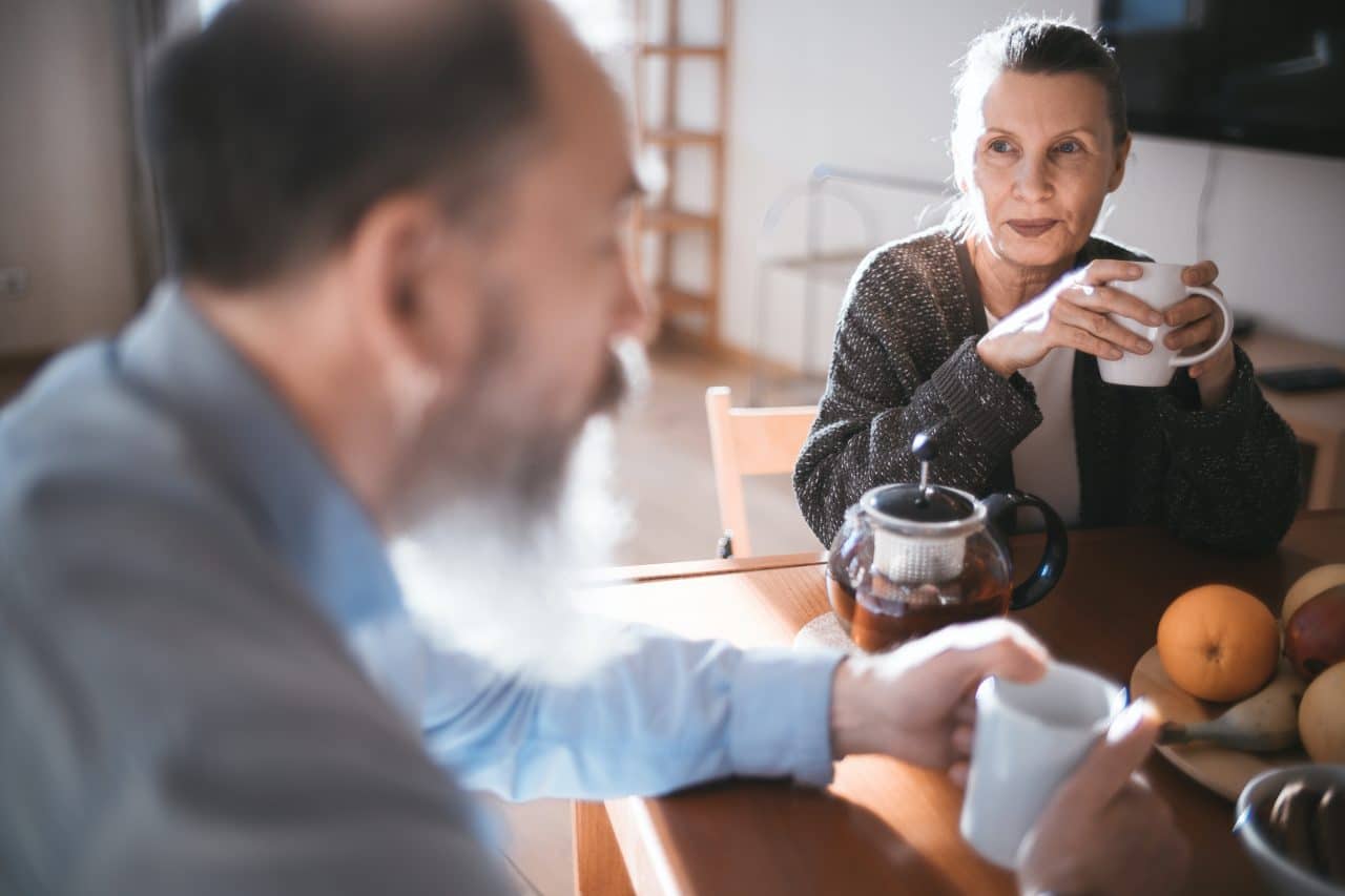 Older couple having breakfast together.