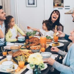 Happy family enjoying Thanksgiving dinner