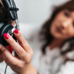 Close up of a person getting a hearing test